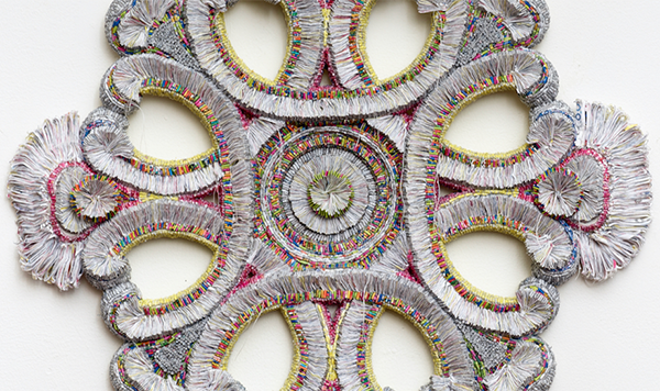 In Search of Beauty #5, 2019 shredded MoMA Design Store catalogs, safety envelopes, promotional mail, thread over armature 23” x 23” x 3”D